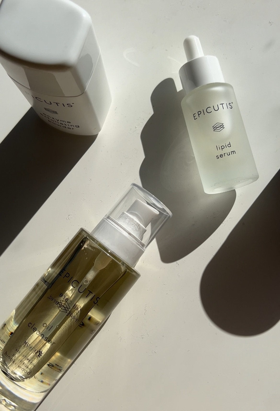 Epicutis skincare in sunlight with sculptural shadows