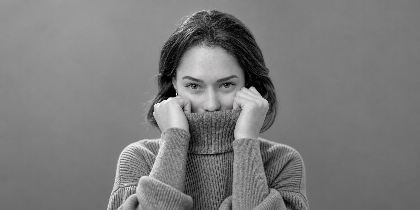 Black-and-white portrait of Gabriela Gupta against a soft gray background